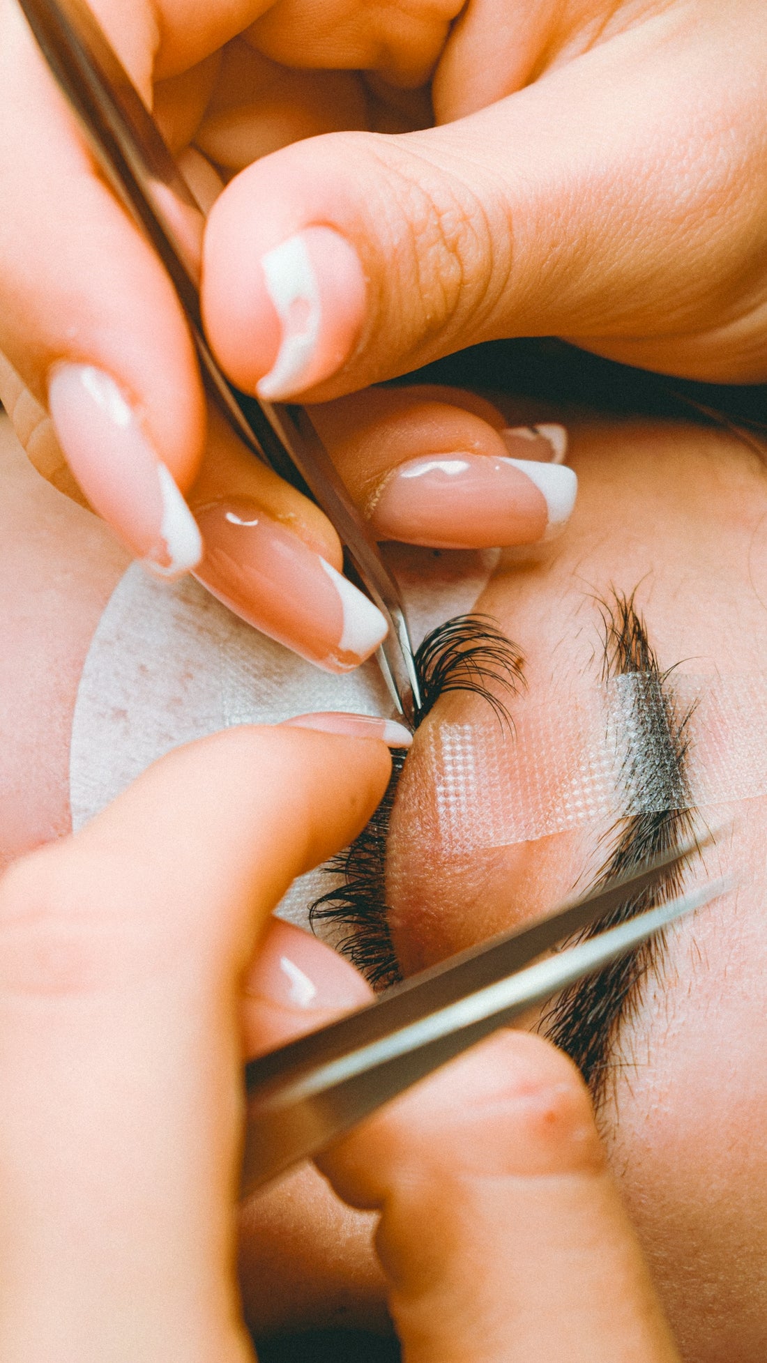 A close up of a person cutting another persons hair